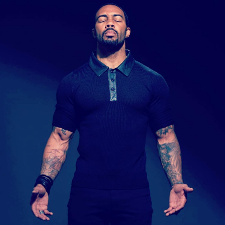 Omari Hardwick with his eyes closed.